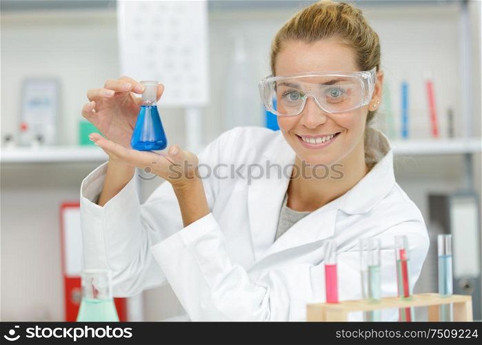 woman with flasks science lab