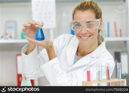 woman with flasks science lab