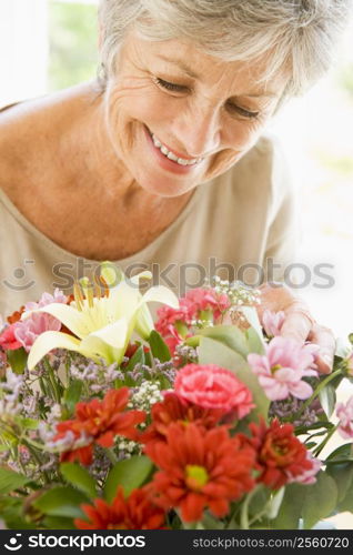 Woman with flowers smiling