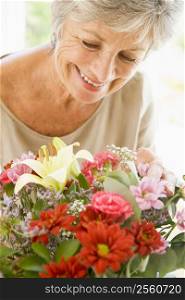 Woman with flowers smiling