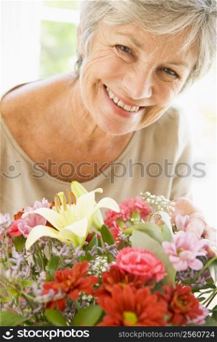 Woman with flowers smiling