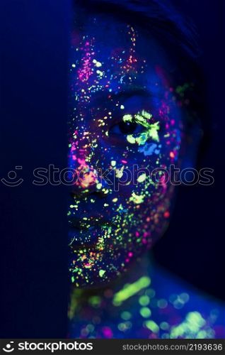 woman with fluorescent make up half face
