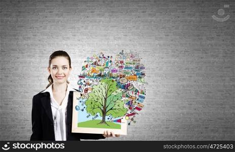 Woman with frame. Young businesswoman holding wooden frame with business sketches