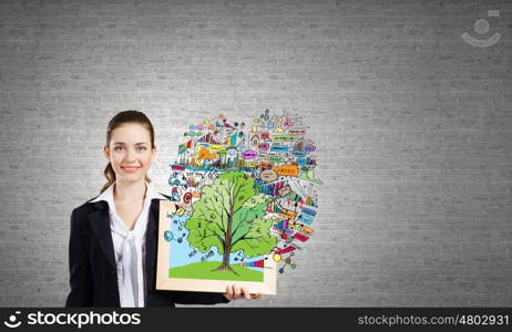 Woman with frame. Young businesswoman holding wooden frame with business sketches