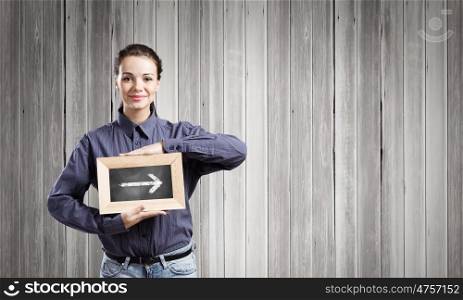 Woman with frame. Young woman in shirt with wooden frame in hands