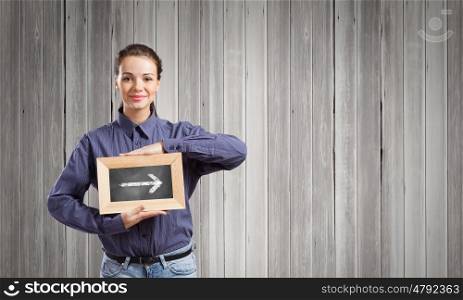 Woman with frame. Young woman in shirt with wooden frame in hands