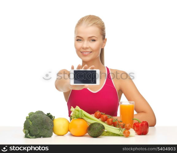 woman with fruits and vegetables counting calories on smartphone