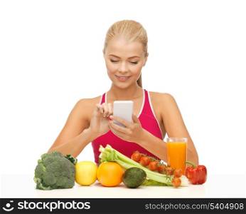 woman with fruits and vegetables counting calories on smartphone