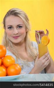 Woman with glass of orange juice