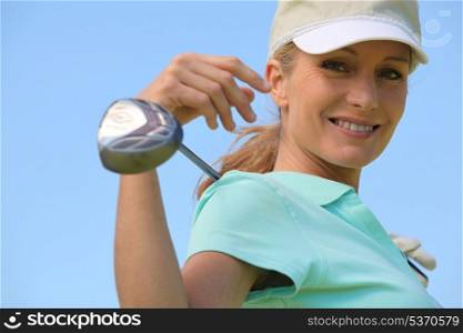 Woman with golf club