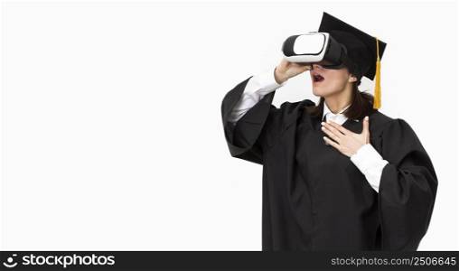 woman with graduation robe cap wearing virtual reality headset 2