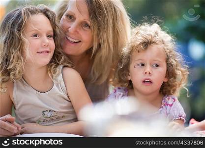Woman with grandchildren outdoors