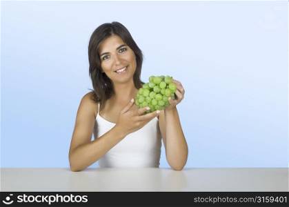 Woman with grapes