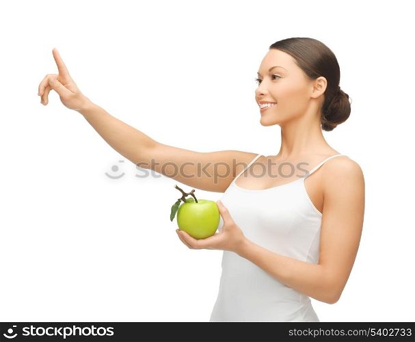 woman with green apple pointing her finger at something.