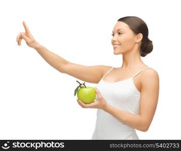 woman with green apple pointing her finger at something.