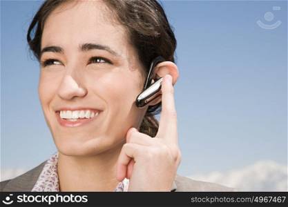 Woman with hands free device