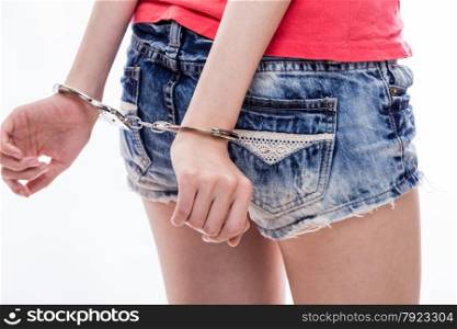 Woman with hands handcuffed behind back