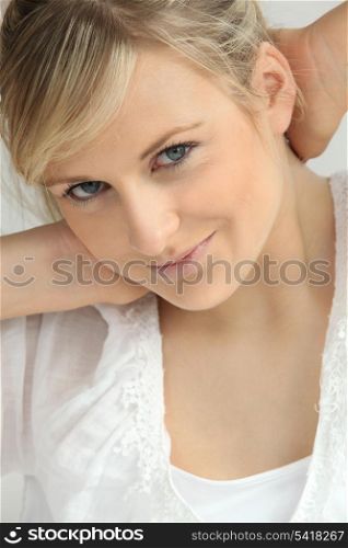 Woman with hands on neck