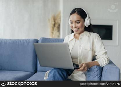 woman with headphones live streaming