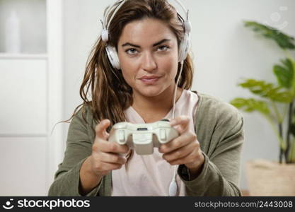 woman with headphones playing with joystick