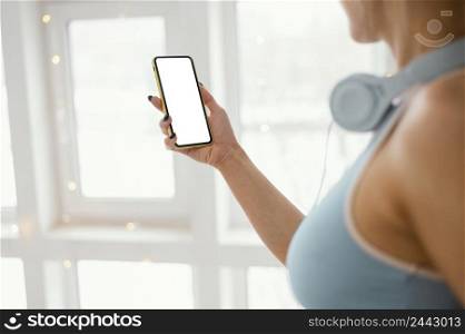 woman with headphones using phone 2