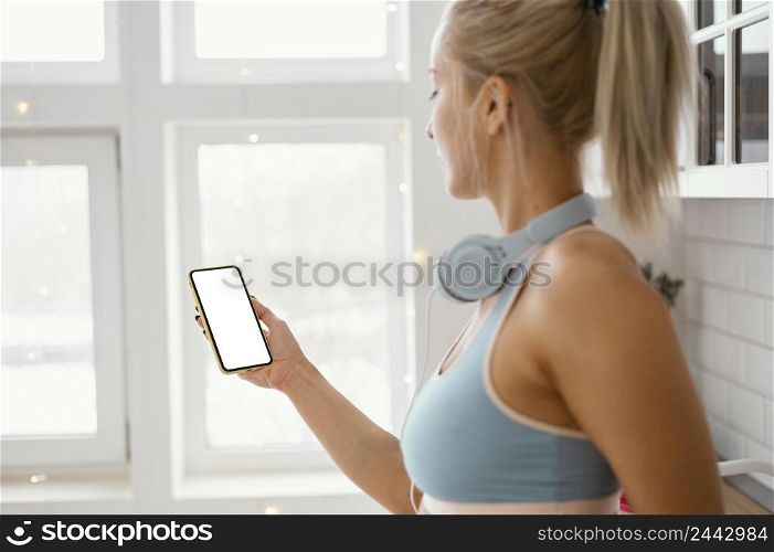 woman with headphones using phone