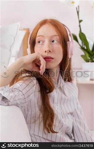 woman with headphones working from home