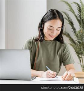 woman with headset having video call laptop 2