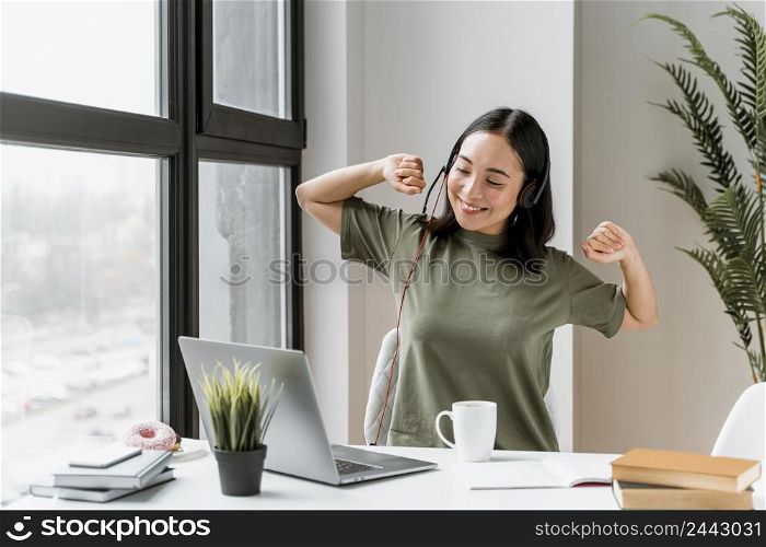 woman with headset having video call laptop 3