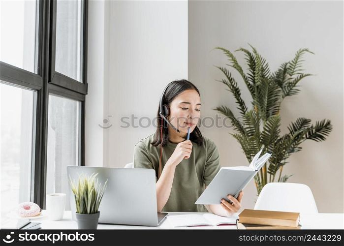 woman with headset having video call laptop 4