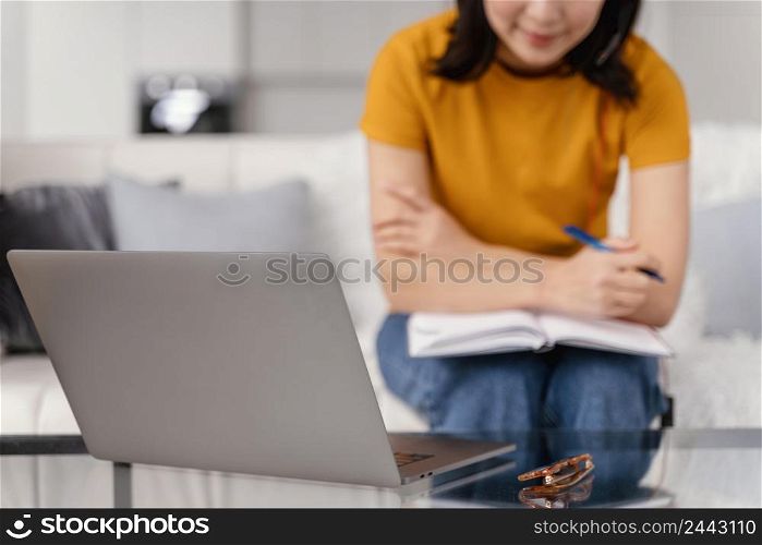 woman with headset video call laptop