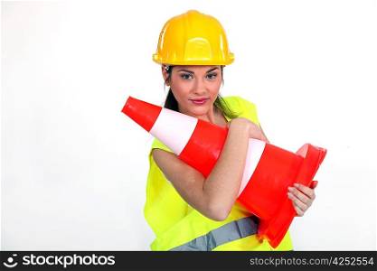 Woman with helmet and warning sign