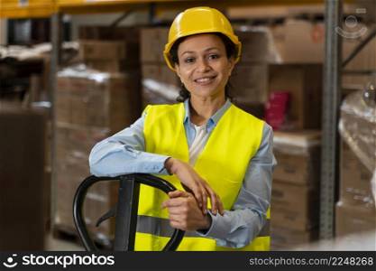woman with helmet working warehouse
