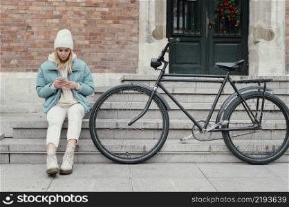 woman with her bike taking break