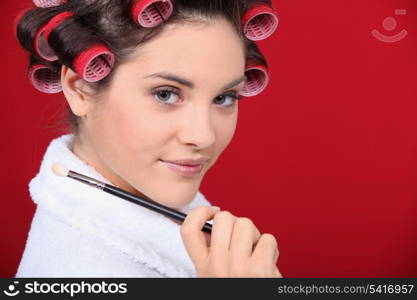 Woman with her hair in rollers