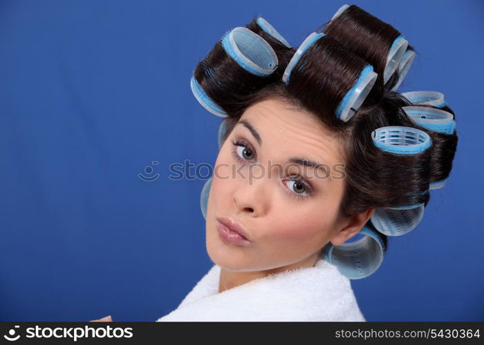 Woman with her hair in rollers