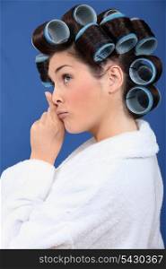 Woman with her hair in rollers