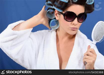 Woman with her hair in rollers
