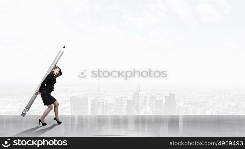 Woman with huge pencil. Young businesswoman carrying big pencil on back