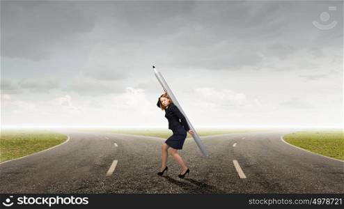 Woman with huge pencil. Young businesswoman carrying big pencil on back