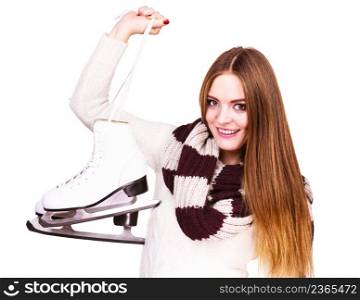 Woman with ice skates getting ready for ice skating, winter sport activity. Smiling cheerful girl wearing warm clothing on white. Smiling woman with ice skates