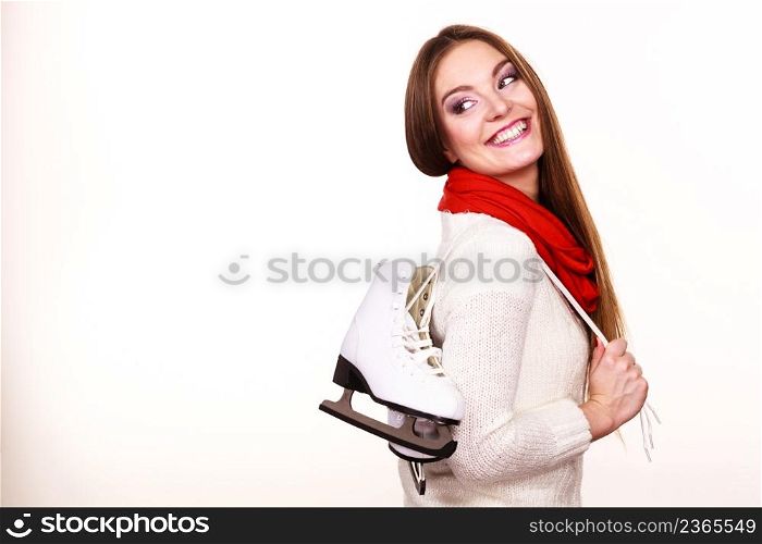 Woman with ice skates getting ready for ice skating, winter sport activity. Smiling cheerful girl wearing warm clothing on white. Smiling woman with ice skates