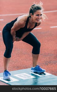 Woman with kettle bell on crossfit competition