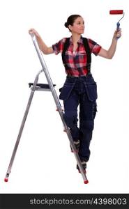 Woman with ladder painting