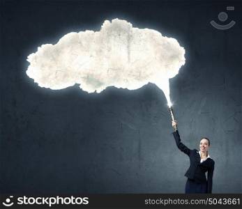 Woman with lantern in hand. Businesswoman in darkness with flashlight in hand and blank cloud