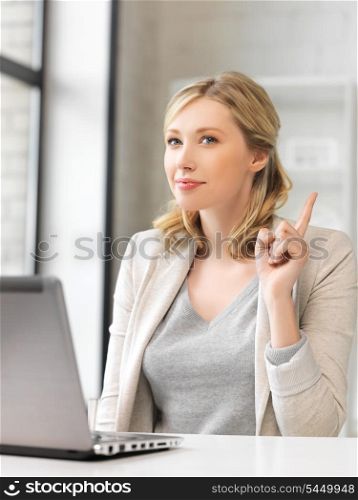 woman with laptop computer and finger up