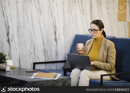 woman with laptop cup