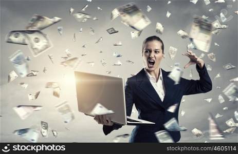 Woman with laptop in hands. Attractive businesswoman with laptop in hands in modern office interior