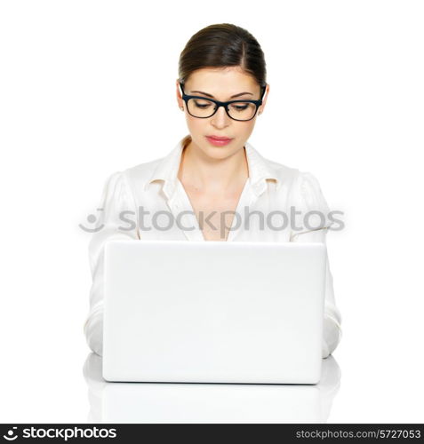 Woman with laptop in white shirt sits from the table - isolated on white. &#xA;