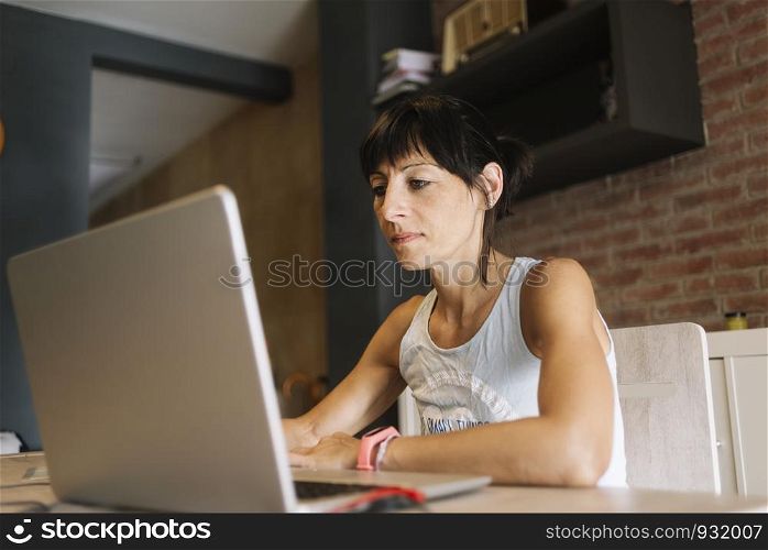 Woman with laptop working at home.. Marta Rodriguez.jpg